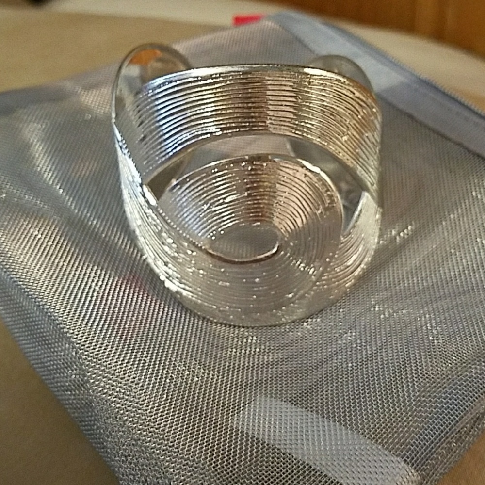 Silver cuff bracelet in pouch